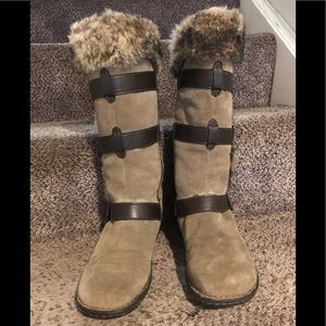 Tan and brown suede boots with leather accents.